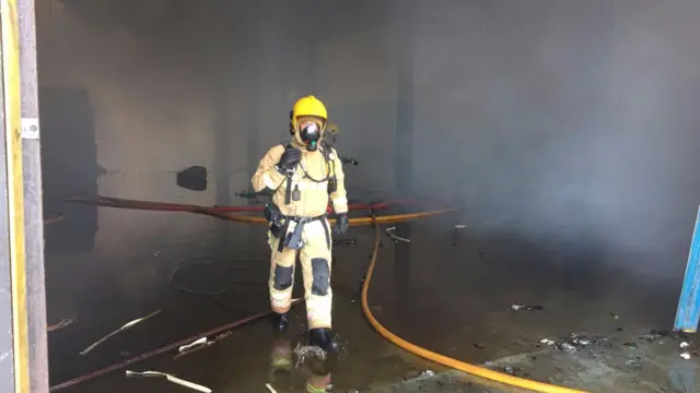 Firefighter tackling blaze