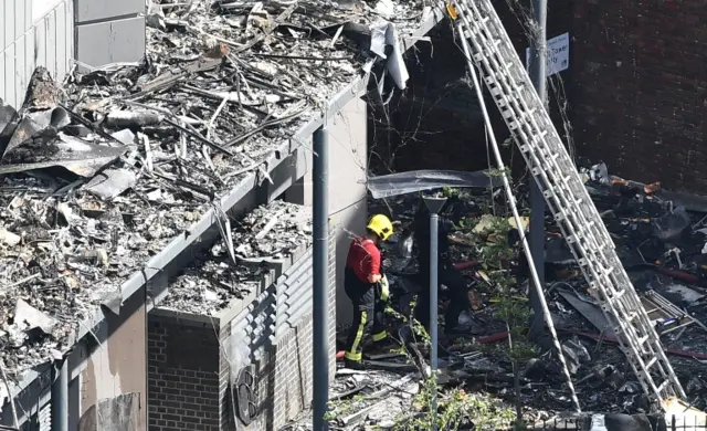 A firefighter in the rubble of the tower