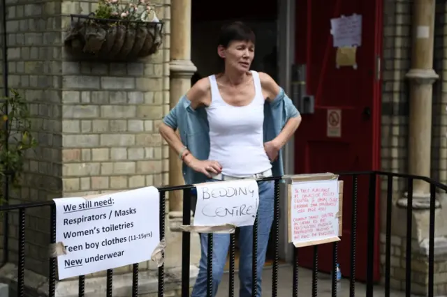 Signs asking for donations are seen outside the Notting Hill methodist Chruch June 14, 2017 in London, England.