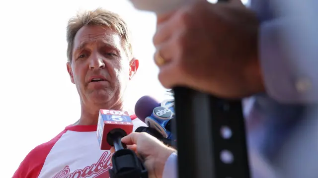 Senator Jeff Flake briefs members of the media near Eugene Simpson Stadium Park