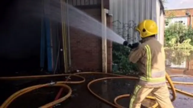 Firefighter tackling blaze