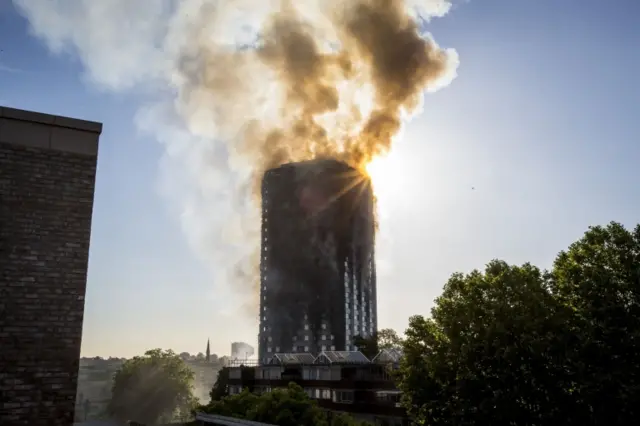 Smoke billows from a fire that has engulfed the 24-storey Grenfell Tower in west London.