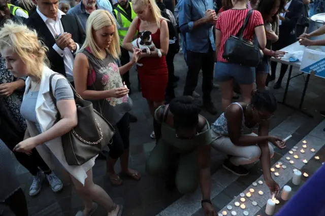 Candles are lit outside Notting Hill Methodist Church