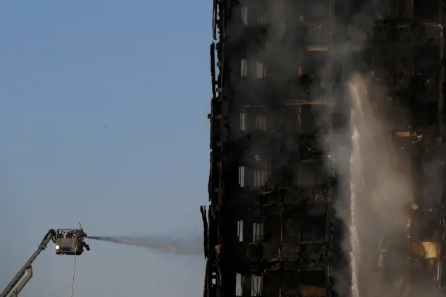 Firefighters tackle a serious fire in a tower block at Latimer Road