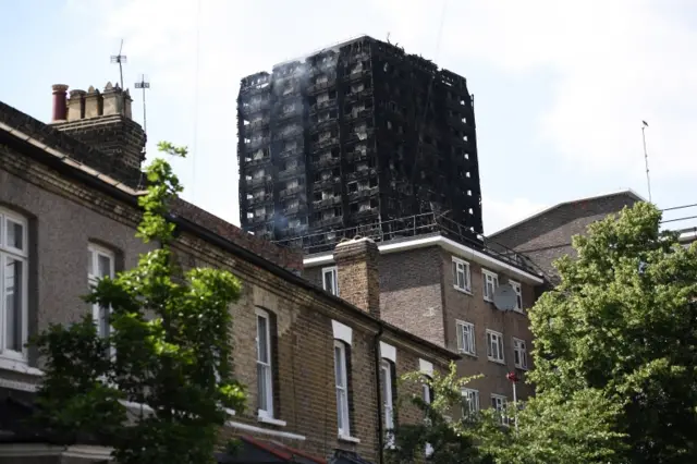 Smoke continues to rise from the 24 storey residential Grenfell Tower block in Latimer Road, West London