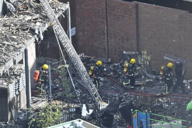 Emergency services close to the scene after a fire engulfed the 24-storey Grenfell Tower in west London