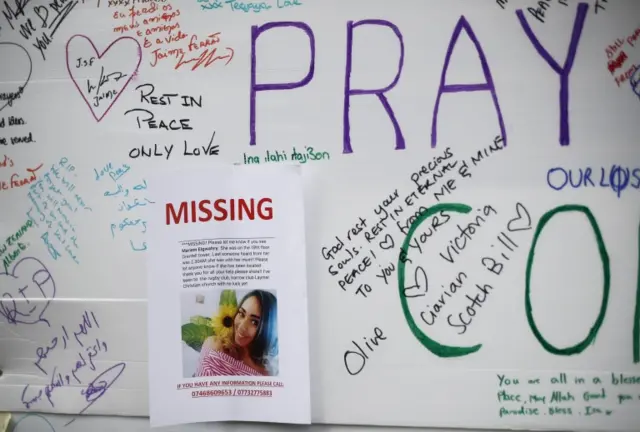 Missing poster attached to wall of condolence at the site in west London