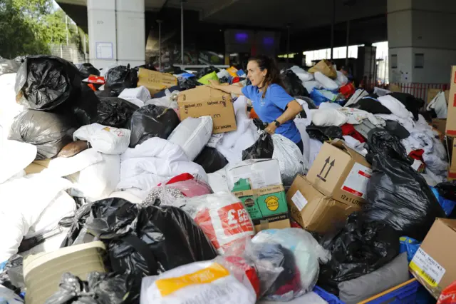 Volunteers wading through donations for Grenfell Tower victims