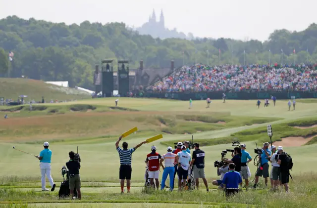 Hideki Matsuyama of Japan plays his shot from the 18th tee at Erin Hills