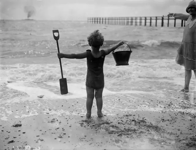 Kid with bucket and spade