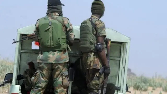 Officers of the Joint Military Task Force (JTF) patrol in the northeastern Nigerian town of Maiduguri, Borno State, on 30 April 2013.