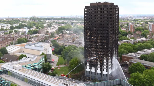 Blackened Grenfell tower in London