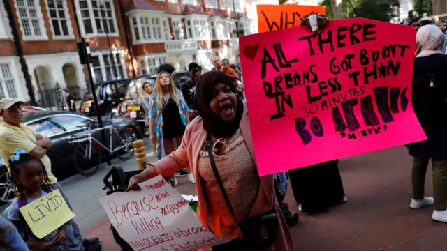 A demonstrator shouts during a protest outside Kensington town hall, following the fire that destroyed The Grenfell Tower block, in north Kensington, West London, June 16, 2017