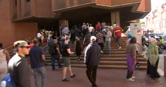 Screen grab showing protesters walking towards Kensington Town Hall