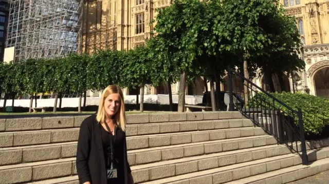 Laura Smith outside Houses of Parliament