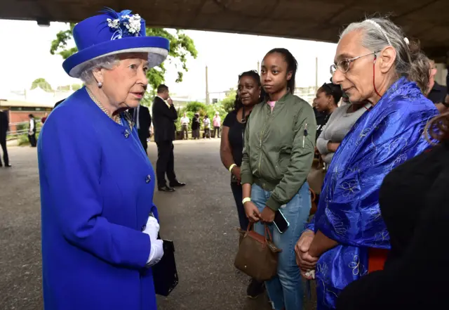 The Queen speaks to volunteers