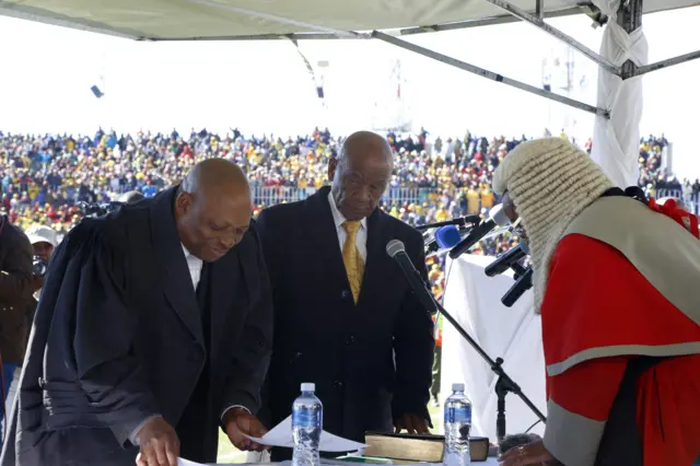 Newly appointed Lesotho prime Minister Thomas Thabane (L), leader of the All Basotho Convention (ABC) political party, is sworn in on June 16, 2017 in Maseru.