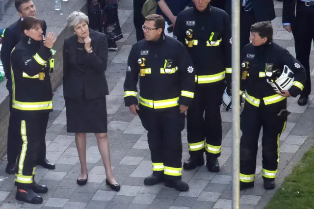 Theresa May at Grenfell Towers