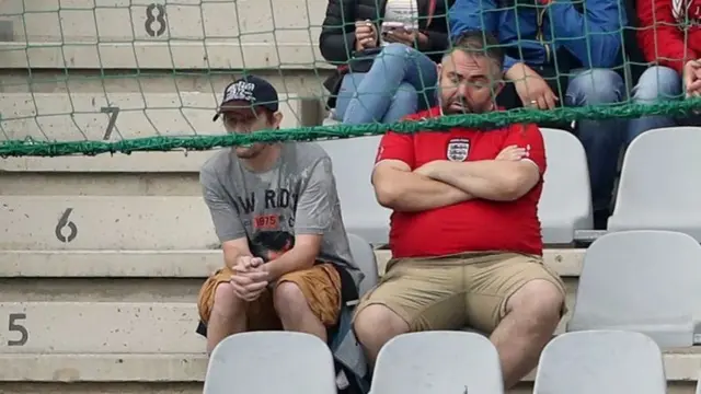 An England fan falls asleep