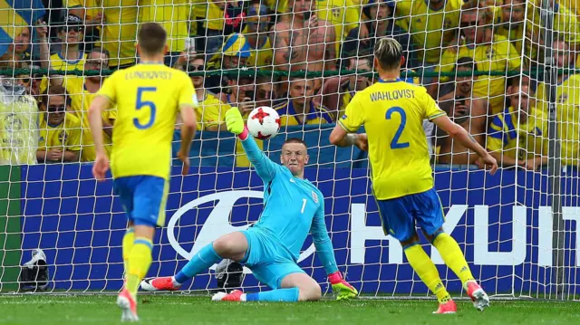 England goalkeeper Jordan Pickford saves a penalty from Linus Wahlqvist of Sweden