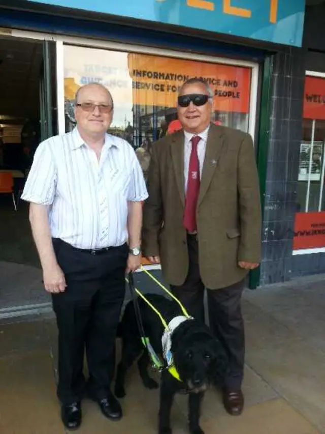 Councillor Roy Miller wearing special glasses to see what it's like for the blind in Barnsley.