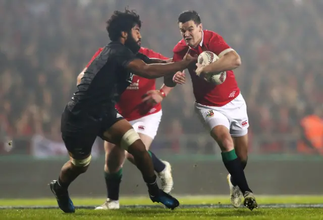 Johnny Sexton of the Lions is challenged by Akira Ioane of the Maori All Blacks