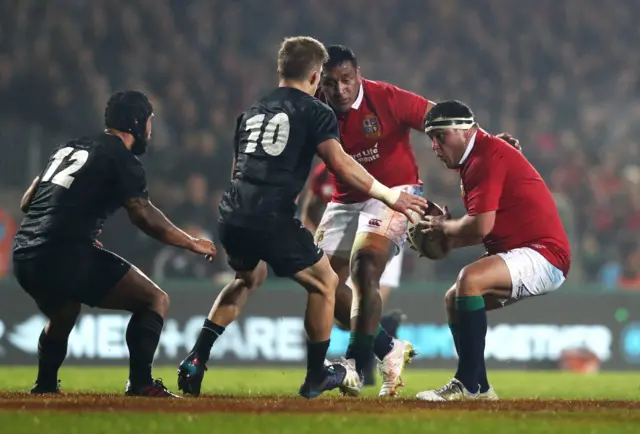 Jamie George of the Lions is confronted