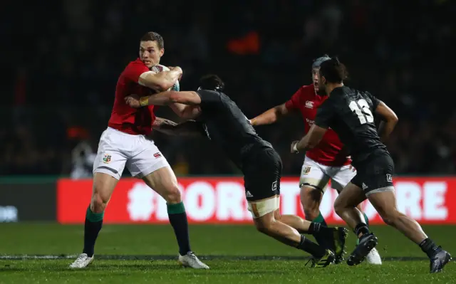 George North of the Lions is tackled by Elliot Dixon of the Maori All Blacks