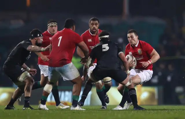 George North of the Lions charges into Tom Franklin of the Maori All Blacks