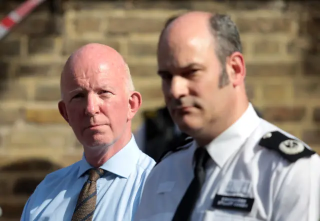 (L-R) Nick Paget Brown, leader of the council and Commander Stuart Cundy of Met Police look on during a press conference near the 24 storey residential Grenfell Tower block in Latimer Road, West London on June 14, 2017 in London, England