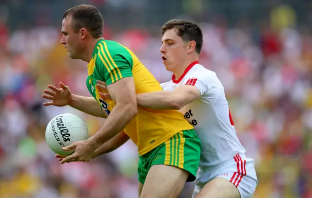 Donegal's Neil McGee in action against Ronan O'Neill of Tyrone