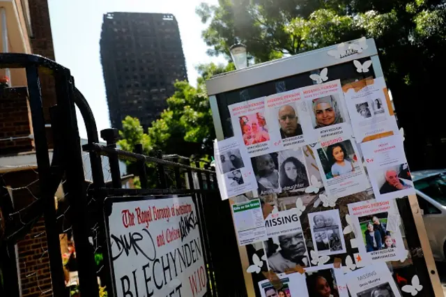 Images of missing people cover a telephone box in Kensington, West London