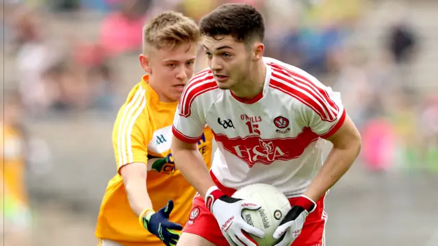 Antrim's Jamie Gribbin and Mark McGrogan of Derry