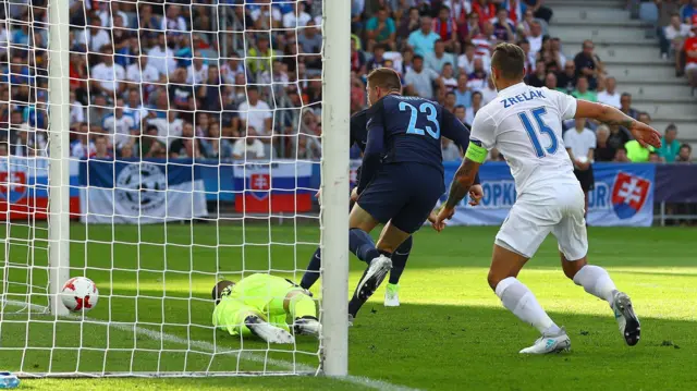 Alfie Mawson of England scores a goal