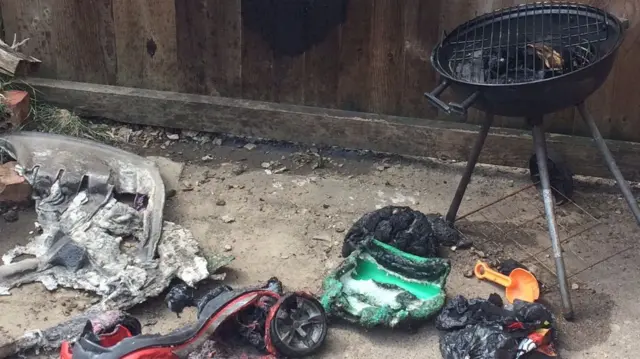 Damaged toys next to barbecue