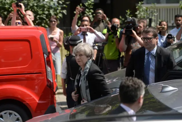 Theresa May arriving