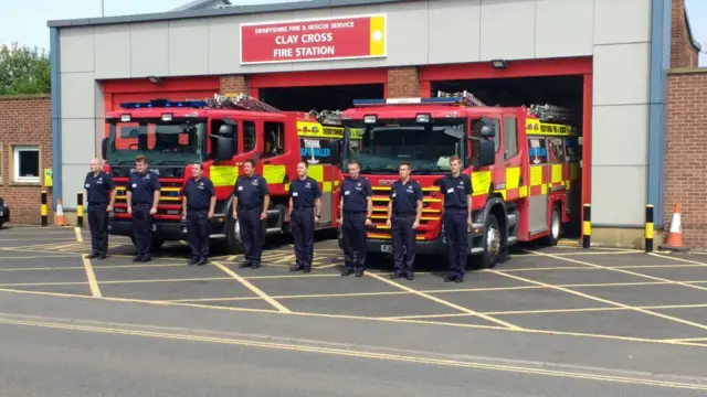 Fire fighters stood in silence