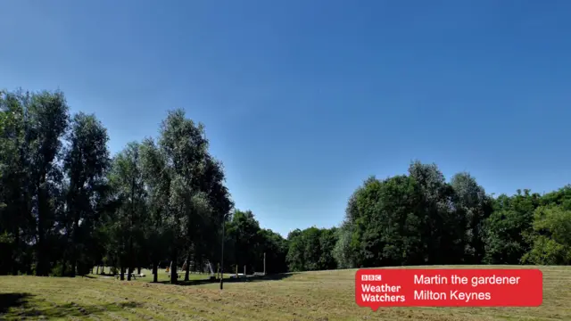 Blue skies over a field in Milton Keynes.