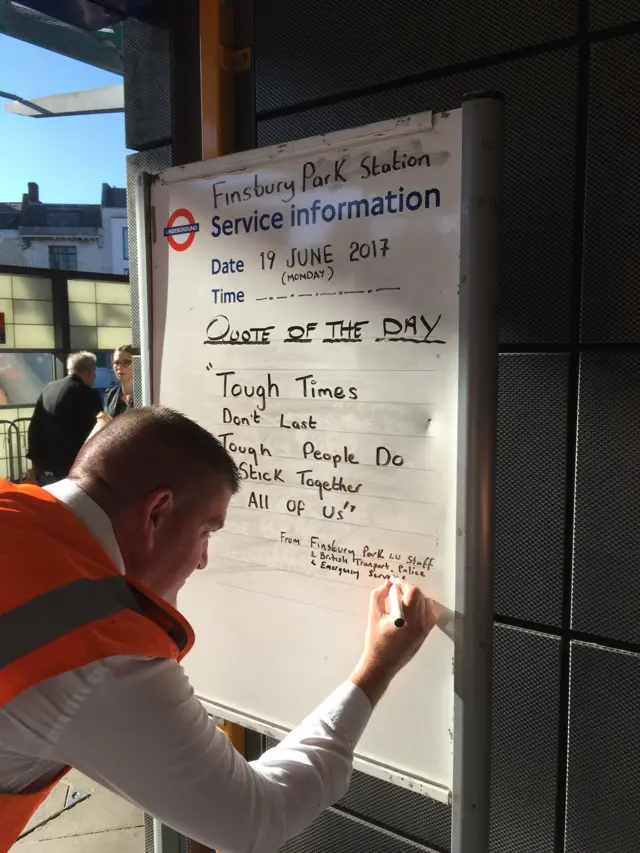 Finsbury Park tube sign saying "tough times don't last. Tough people stick together. All of us."