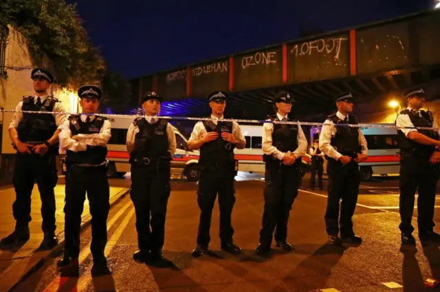 Police line up in Finsbury Park