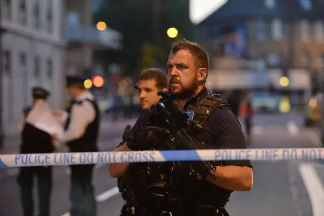 Armed police at the cordon