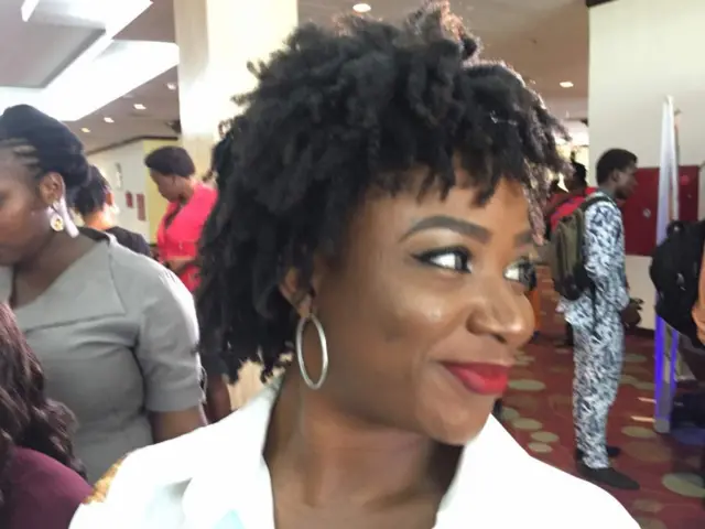 Woman showing off her hairstyle