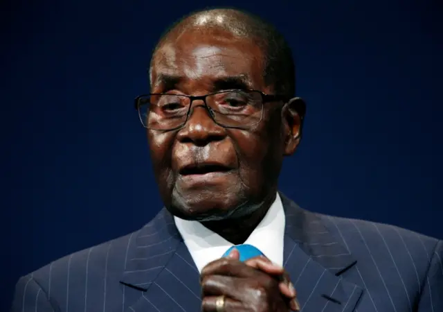 Zimbabwean President Robert Mugabe leaves the stage after participating in a discussion at the World Economic Forum on Africa 2017 meeting in Durban, South Africa May 4, 2017.