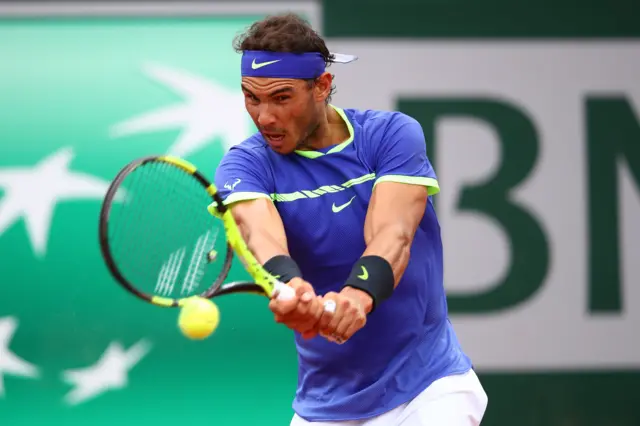 Rafael Nadal of Spain hits a backhand