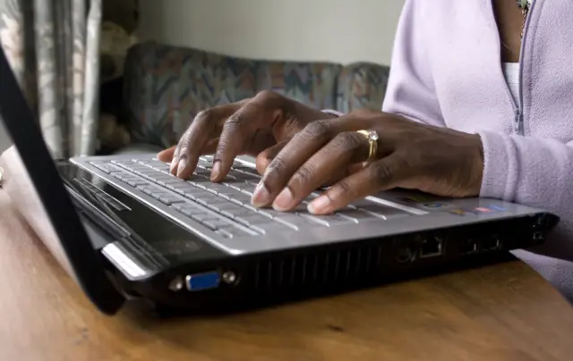 Person typing on a laptop