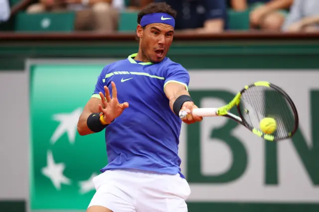 Rafael Nadal plays a forehand