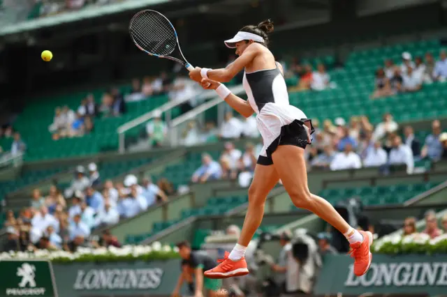 Garbine Muguruza hits a return