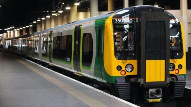 A London Midland train on a platform.