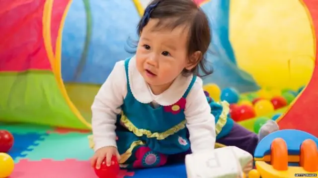 little girl in play area