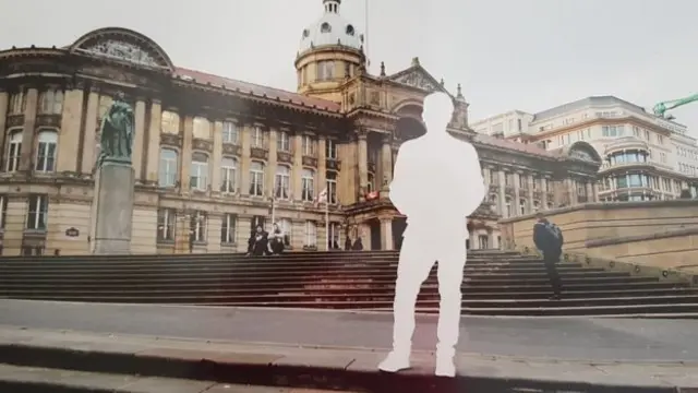 One of Hassan's images - a silhouette figure outside council house